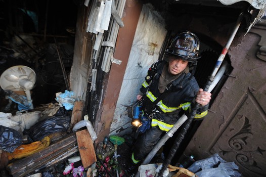 Todd Maisel's photo of firefighters in a burned out Brownstone in Bedford-Stuyvesant.
